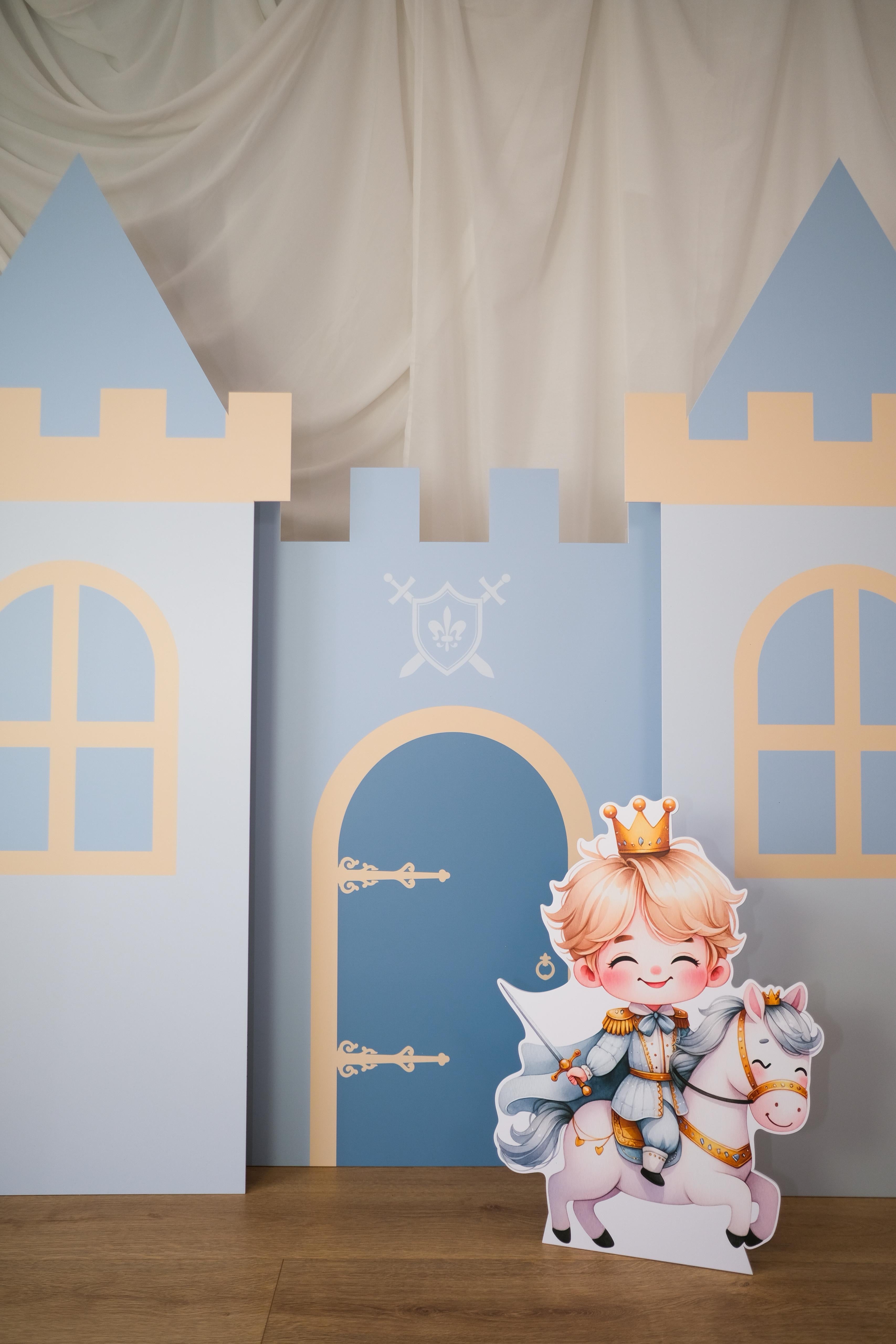 Full view of Knight Castle waterproof foamex castle set showing middle tower and side towers with blue doors, arched windows, and battlements medieval knight party prop