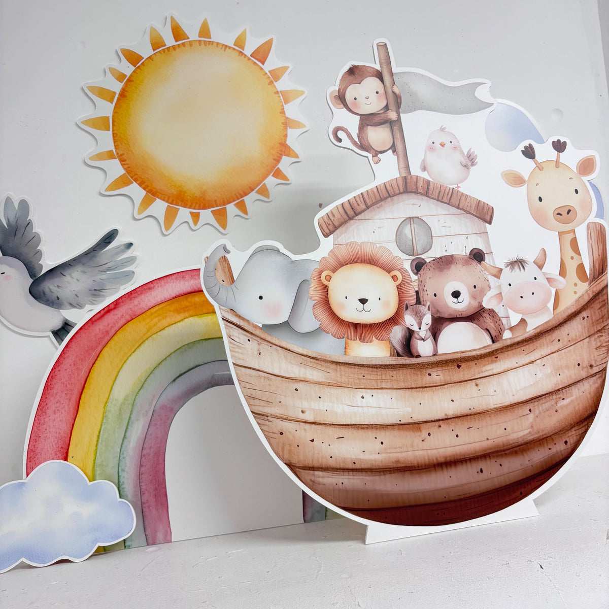 Close-up of Mini Noah's Ark waterproof foamex cutouts showing ark with lion, bear, giraffe, monkey, elephant, dove, rainbow, sunshine, and cloud decorations