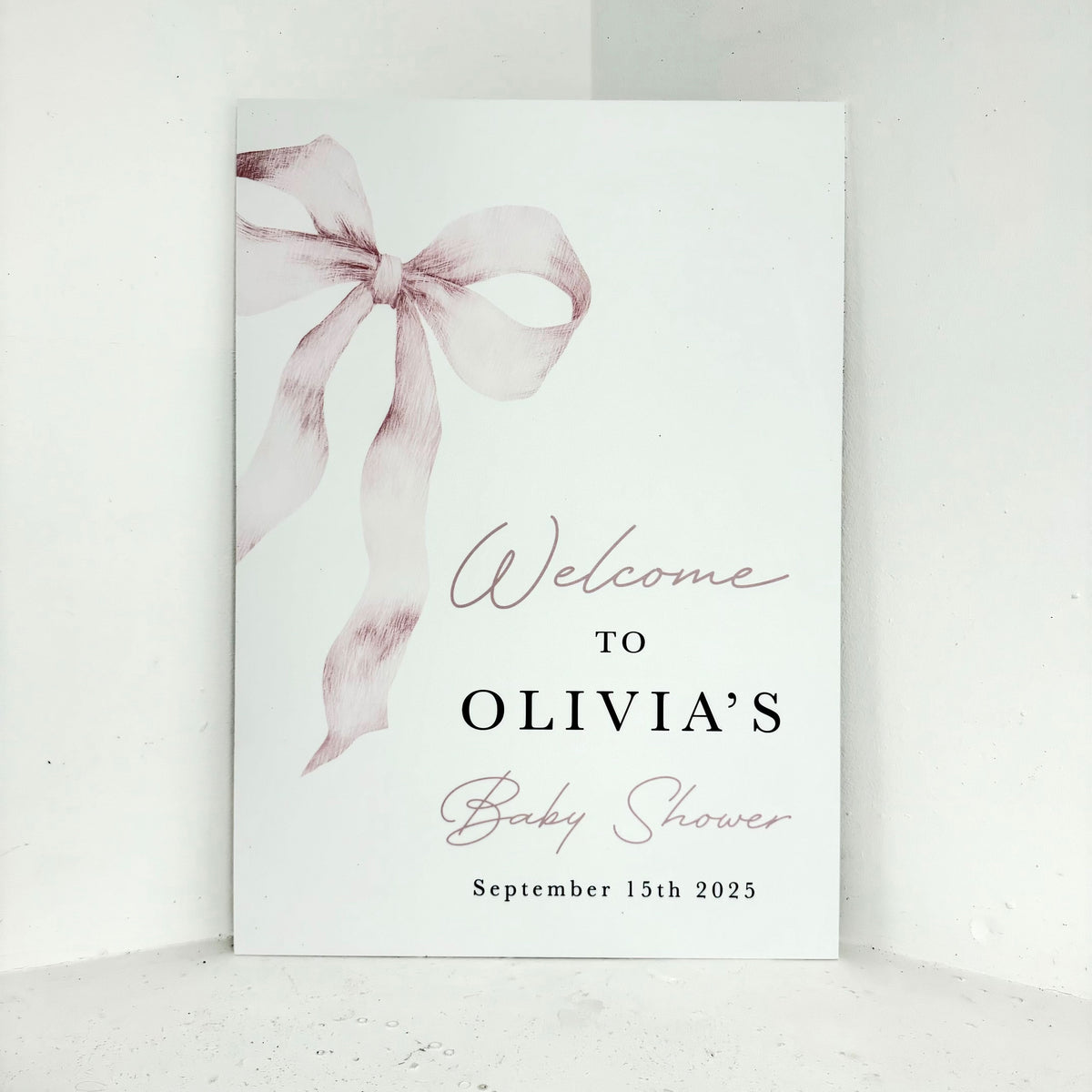 Pink Bow Baby Shower personalised welcome easel sign with elegant ribbon bow design and customisable name and date on waterproof foamex board