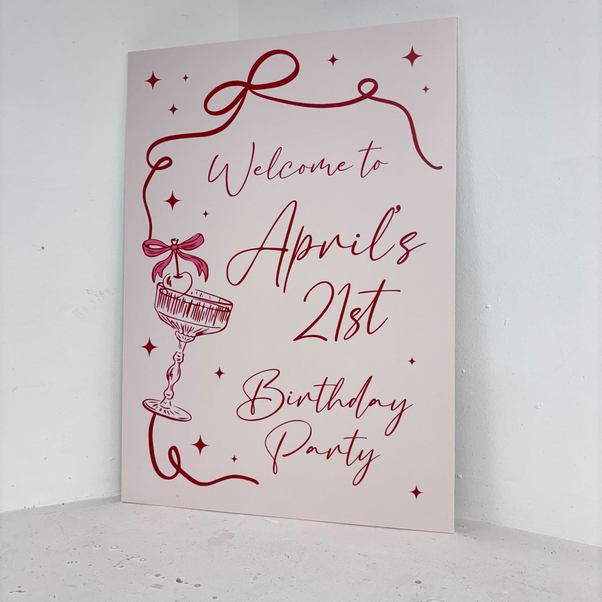Cocktail 21st Birthday easel sign angled view showing personalised name with cocktail illustrations on freestanding foamex board