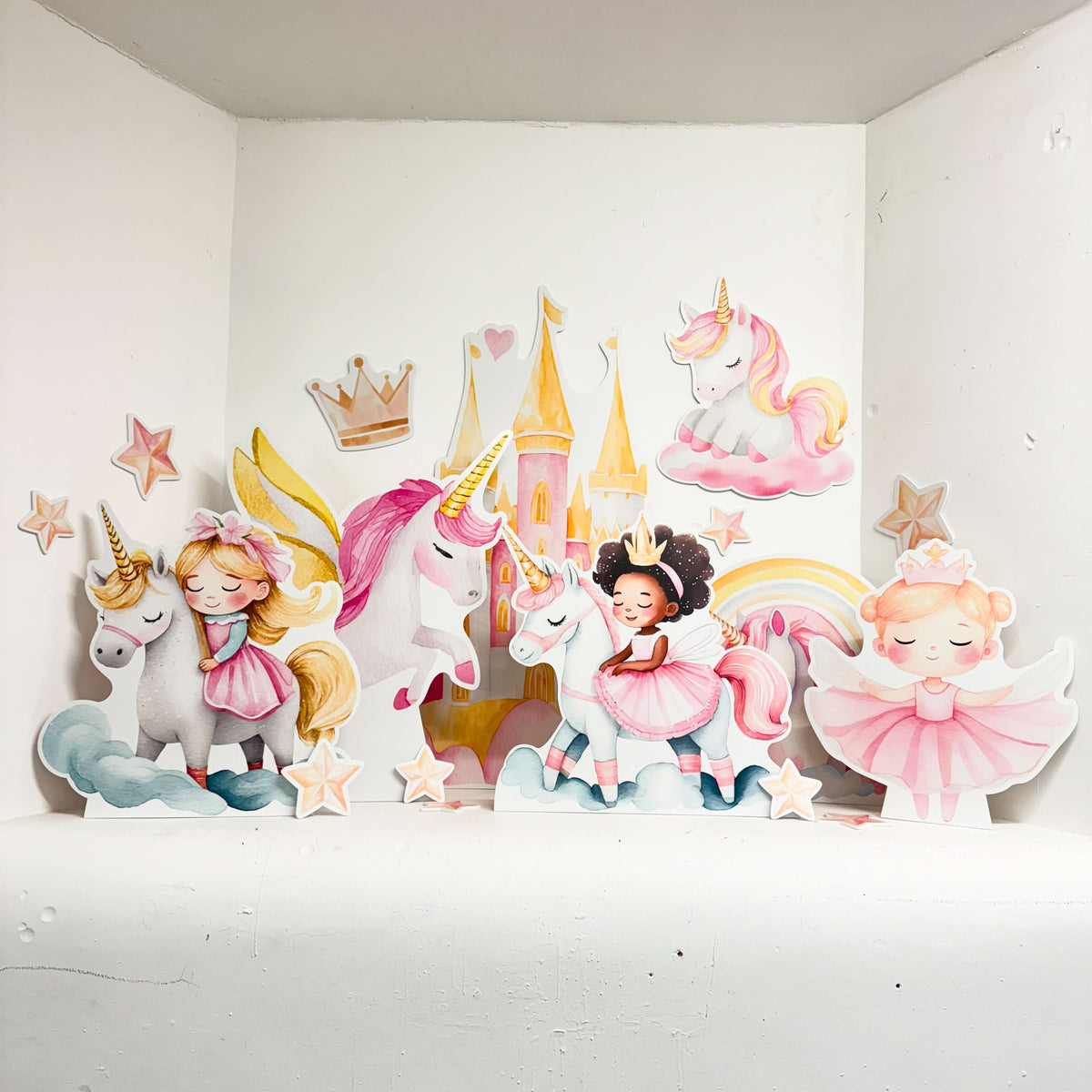 Unicorn Princess Bundle featuring personalised waterproof foamex cutouts including pink castle, unicorns, princesses in pink dresses, rainbow, crown, and star decorations