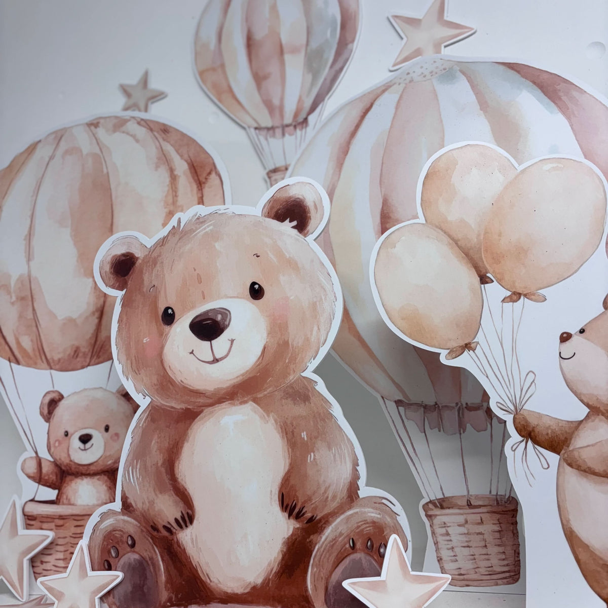 Close-up of Mini Teddy Bear waterproof foamex cutouts showing large teddy bear with hot air balloons, stars, and neutral-toned balloon party decorations