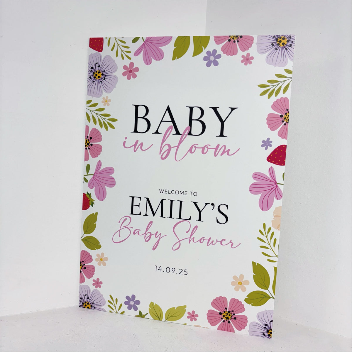 Close-up of Baby in Bloom personalised baby shower welcome sign with colourful floral border, custom name and date on waterproof foamex board