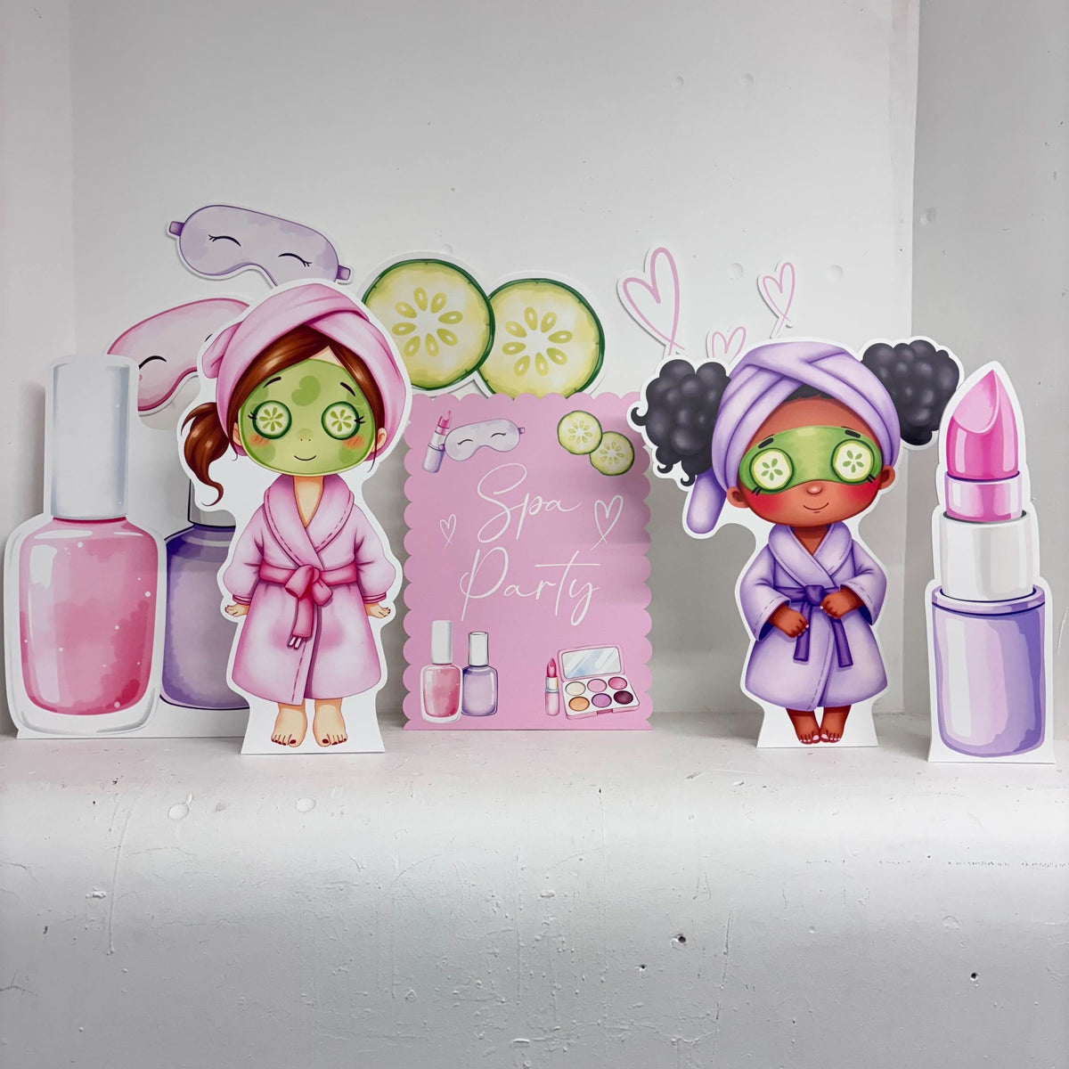 Mini Spa Party Bundle featuring personalised waterproof foamex cutouts including spa party sign, nail polish, lipstick, and girls in robes with face masks and cucumber decorations