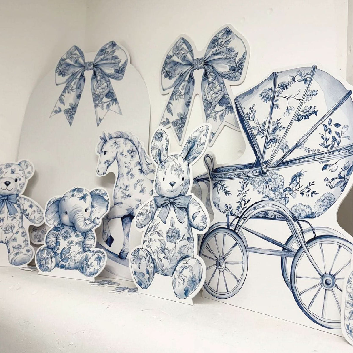 Blue Baby Set Bundle featuring personalised waterproof foamex cutouts including blue floral teddy bears, bunny, rocking horse, stroller, bows, and sail board baby shower decorations