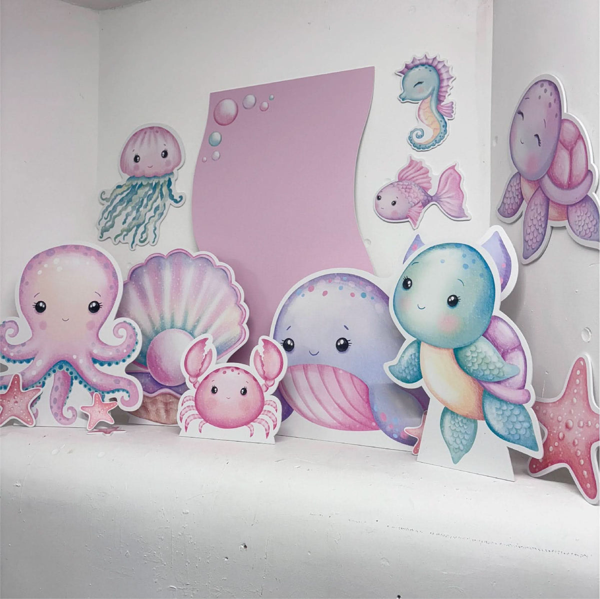 Dreamy Under The Sea Bundle featuring personalised waterproof foamex cutouts including pastel octopus, whale, jellyfish, seahorse, crab, shell, and wavy sail board decorations
