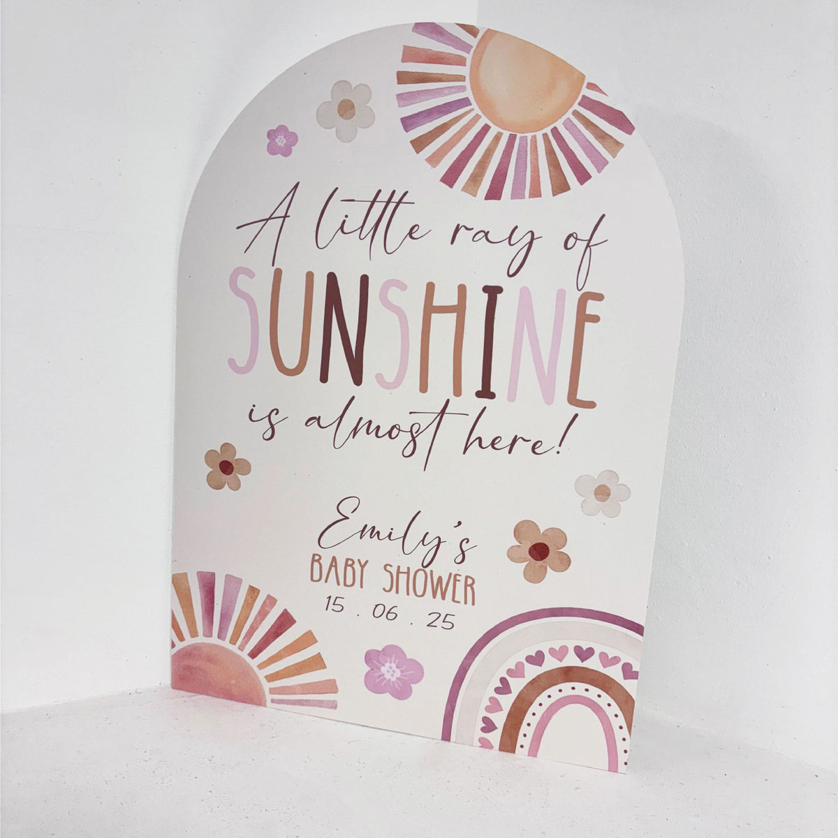 Close-up of A Little Ray of Sunshine personalised baby shower welcome sign with boho sun, rainbow and floral details, custom name and date on waterproof foamex board