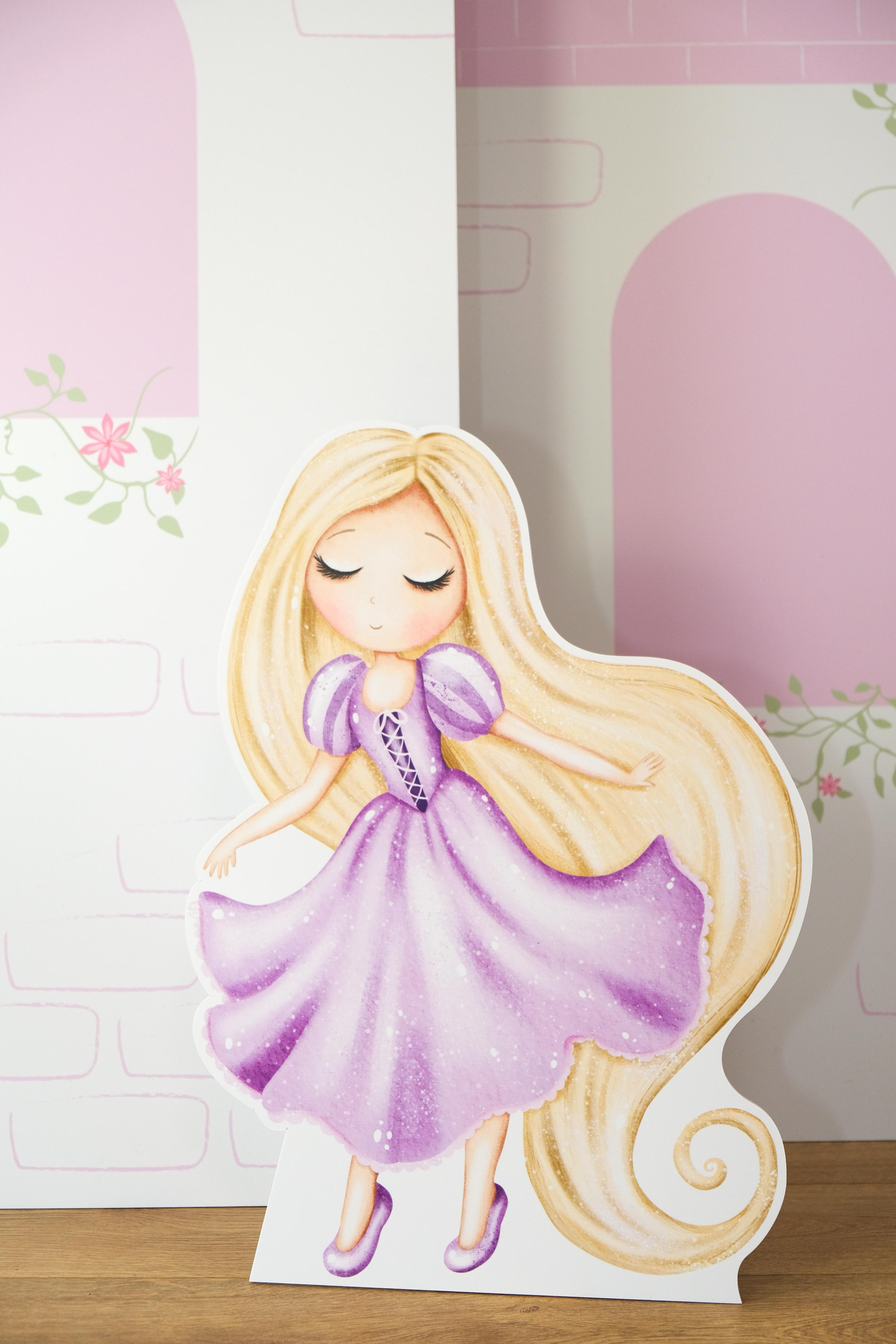 Princess cutout prop displayed with Floral Bloom Castle waterproof foamex castle set visible in background showing pink roofs and floral details party prop