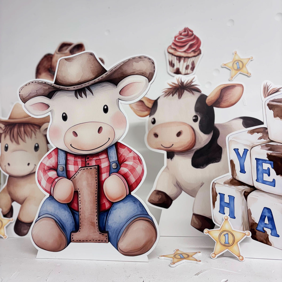 Close-up of Mini My First Rodeo waterproof foamex cutouts showing number cow, cowboy cow, horse with sheriff badge and YEEHAW letter blocks