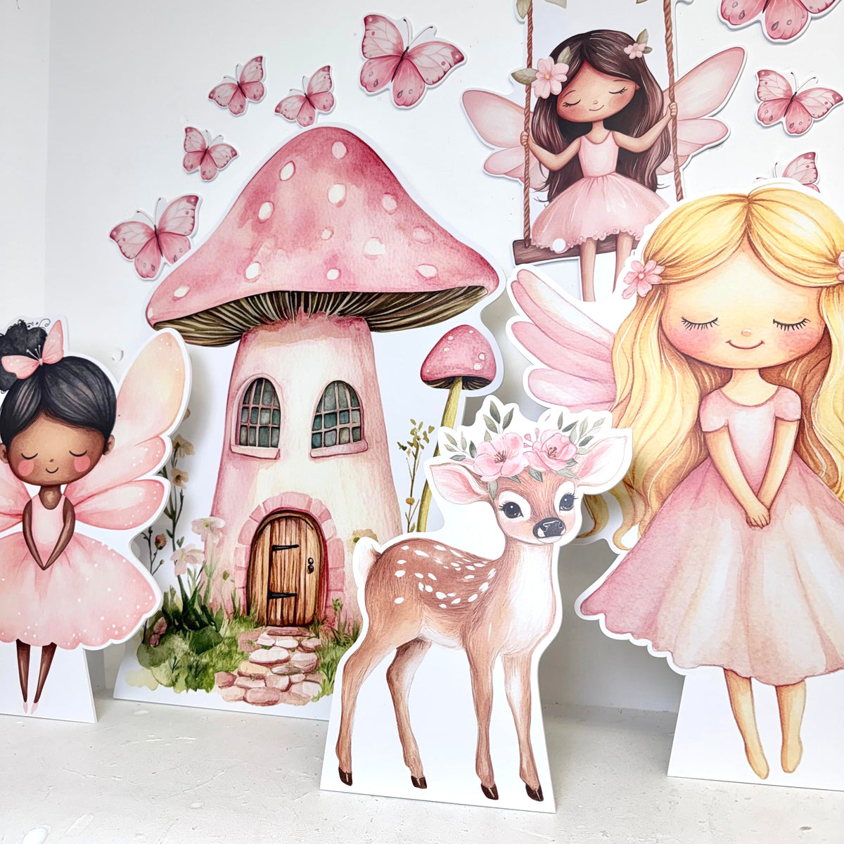Mini Pretty Pink Fairies party decoration bundle featuring waterproof foamex cutouts including a pink mushroom house, blonde fairy, brown haired fairy with butterflies and deer