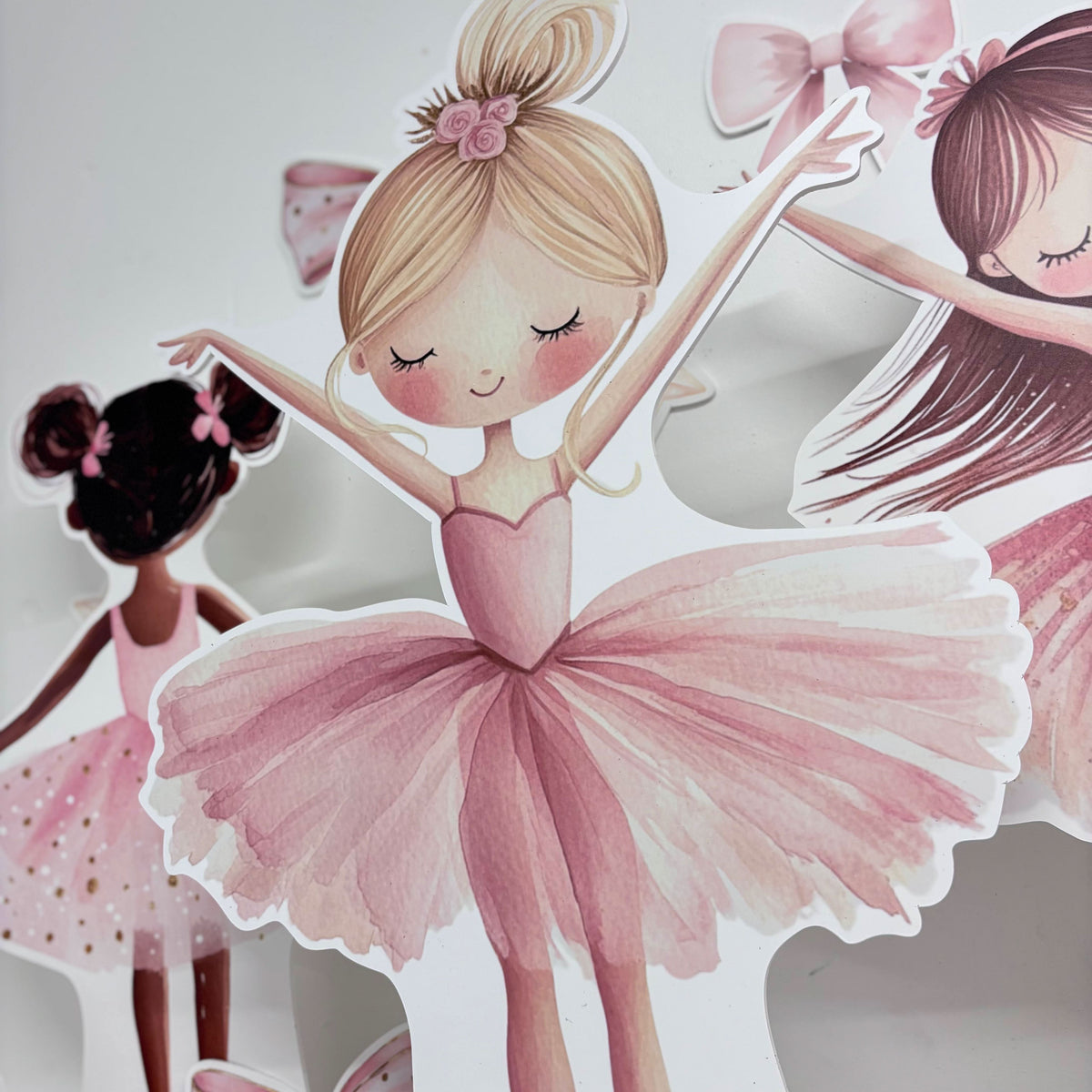 Close-up of Mini Swan Lake waterproof foamex cutouts showing blonde ballerina girl in pink tutu with brown and black haired ballerinas and ballet decorations