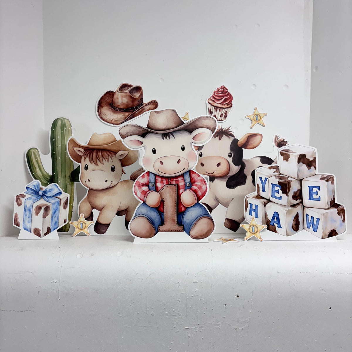 Mini My First Rodeo Bundle featuring personalised waterproof foamex cutouts including number cow, cow, horse, cactus, and cowboy-themed decorations