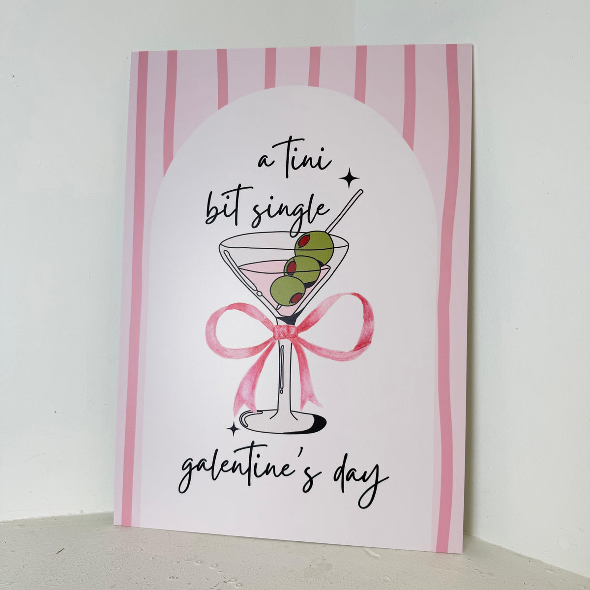 Tini Bit Single easel sign with pink stripes, martini glass illustration and bow – Galentine's Day foamex party sign by Zebra Print Events