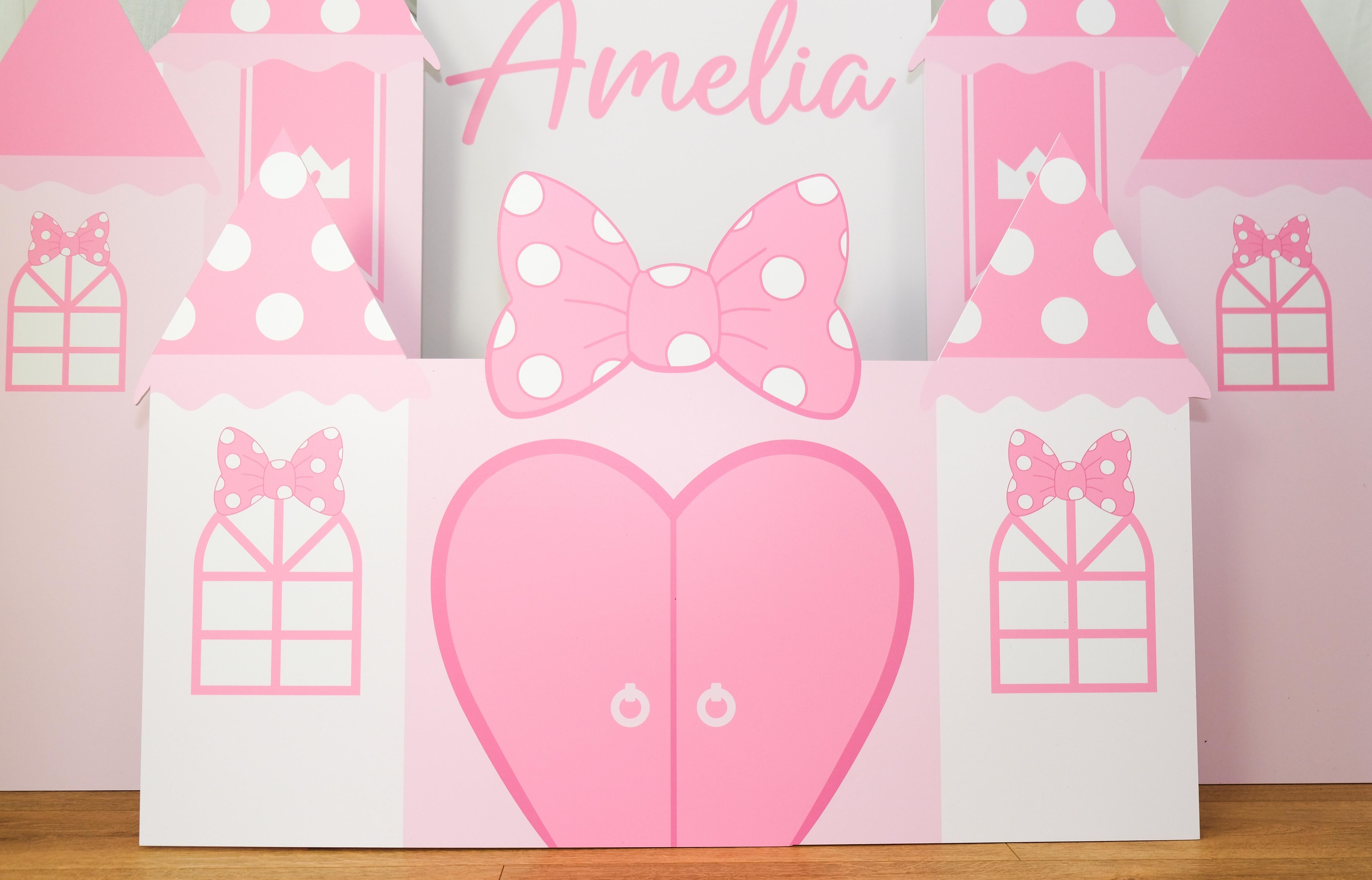 Front view of Pink Mouse Castle waterproof foamex castle set showing personalised name, large pink heart, polka dot bow, and side towers with present boxes princess party prop