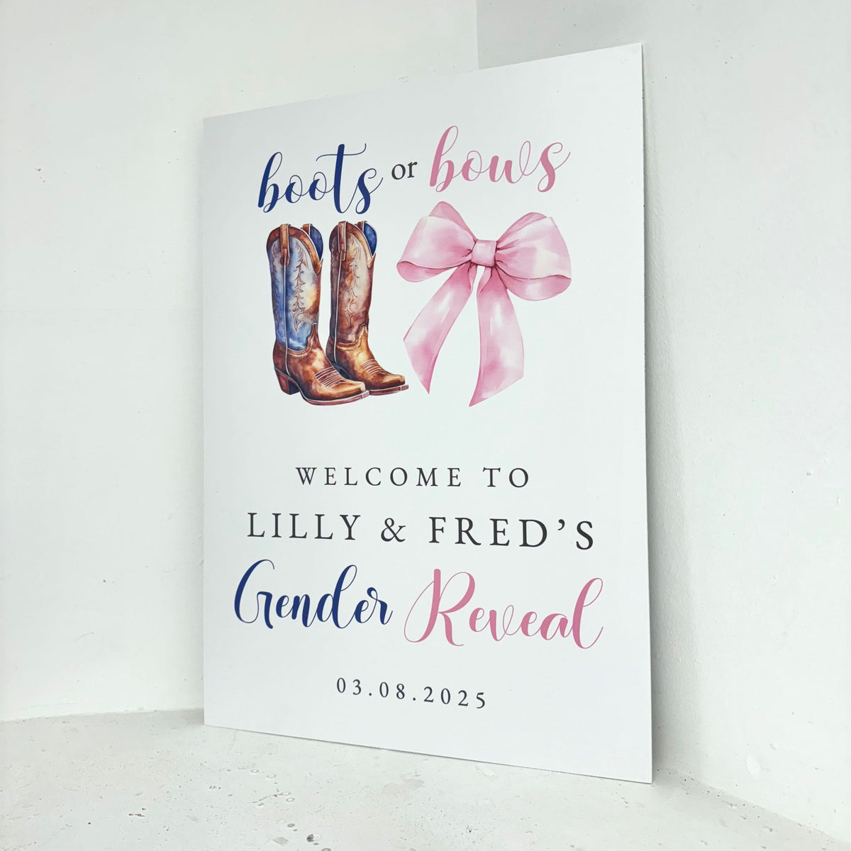 Close-up of Boots and Bows personalised gender reveal welcome sign showing customisable names and date with cowboy boots and pink bow on freestanding foamex board