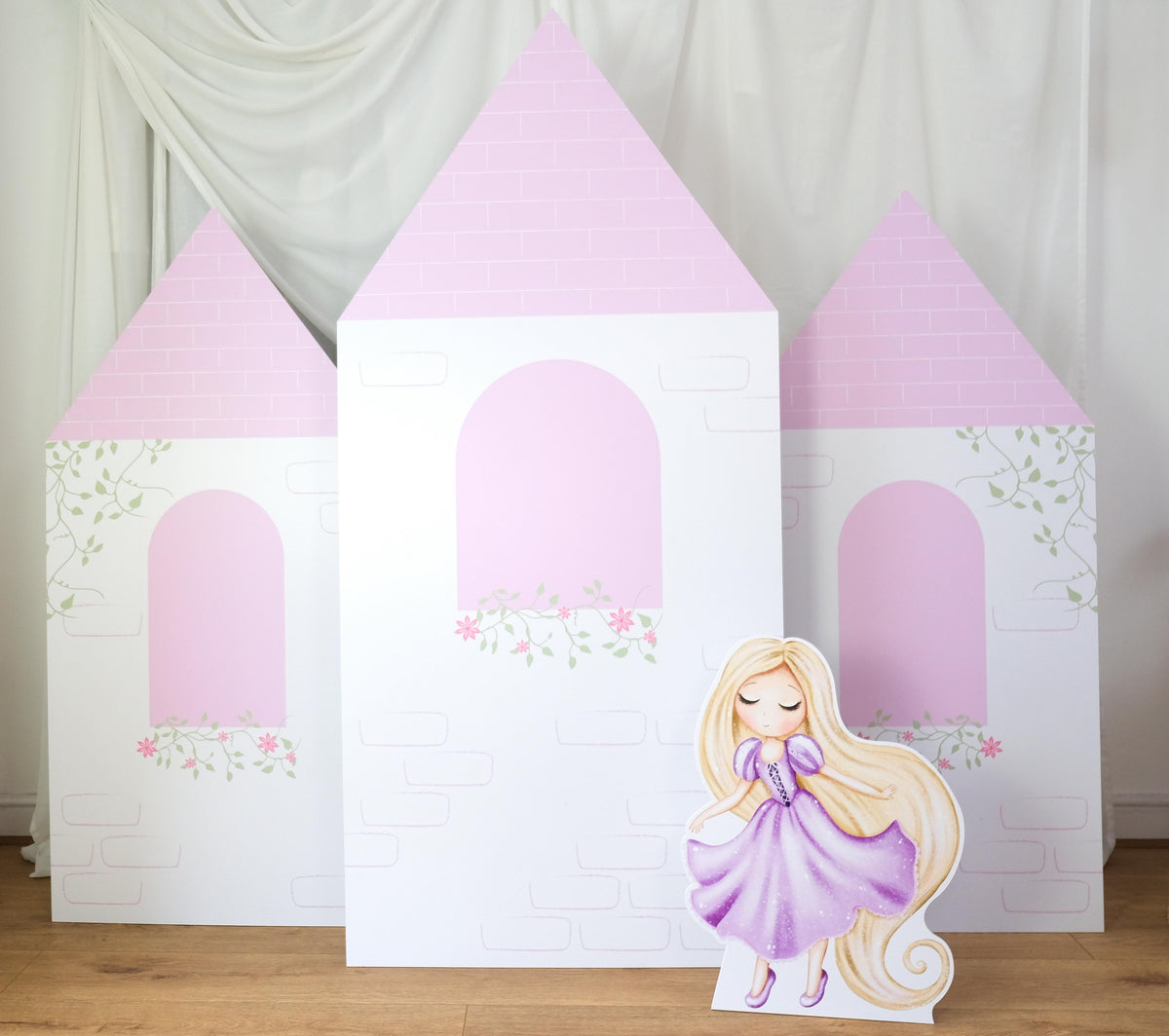 Floral Bloom Castle waterproof foamex castle set featuring pink roofs, white towers, floral vine details, and arched doorway princess party prop