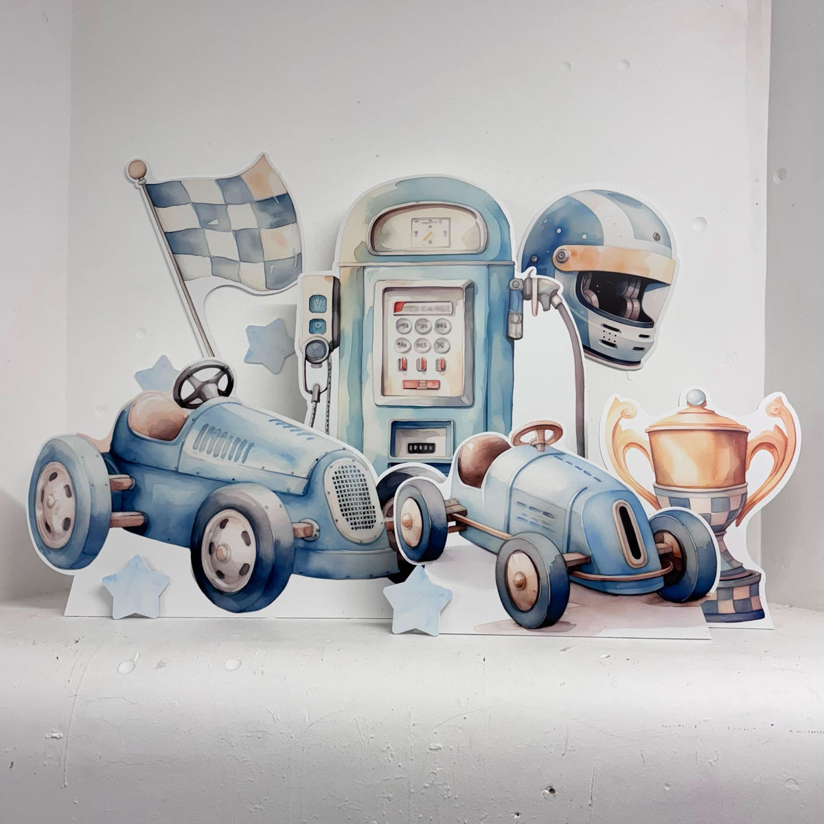 Mini Blue Race Car Bundle featuring personalised waterproof foamex cutouts including vintage blue race cars, petrol pump, racing helmet, checkered flag, and trophy decorations