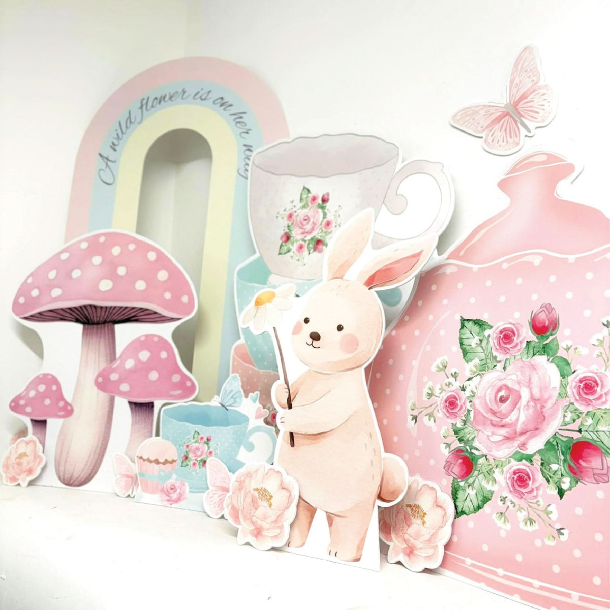 Enchanted Tea Party Bundle featuring personalised waterproof foamex cutouts including arch sail board, teapot, teacup stack, bunny, mushrooms, roses, rainbow, and butterfly party decorations
