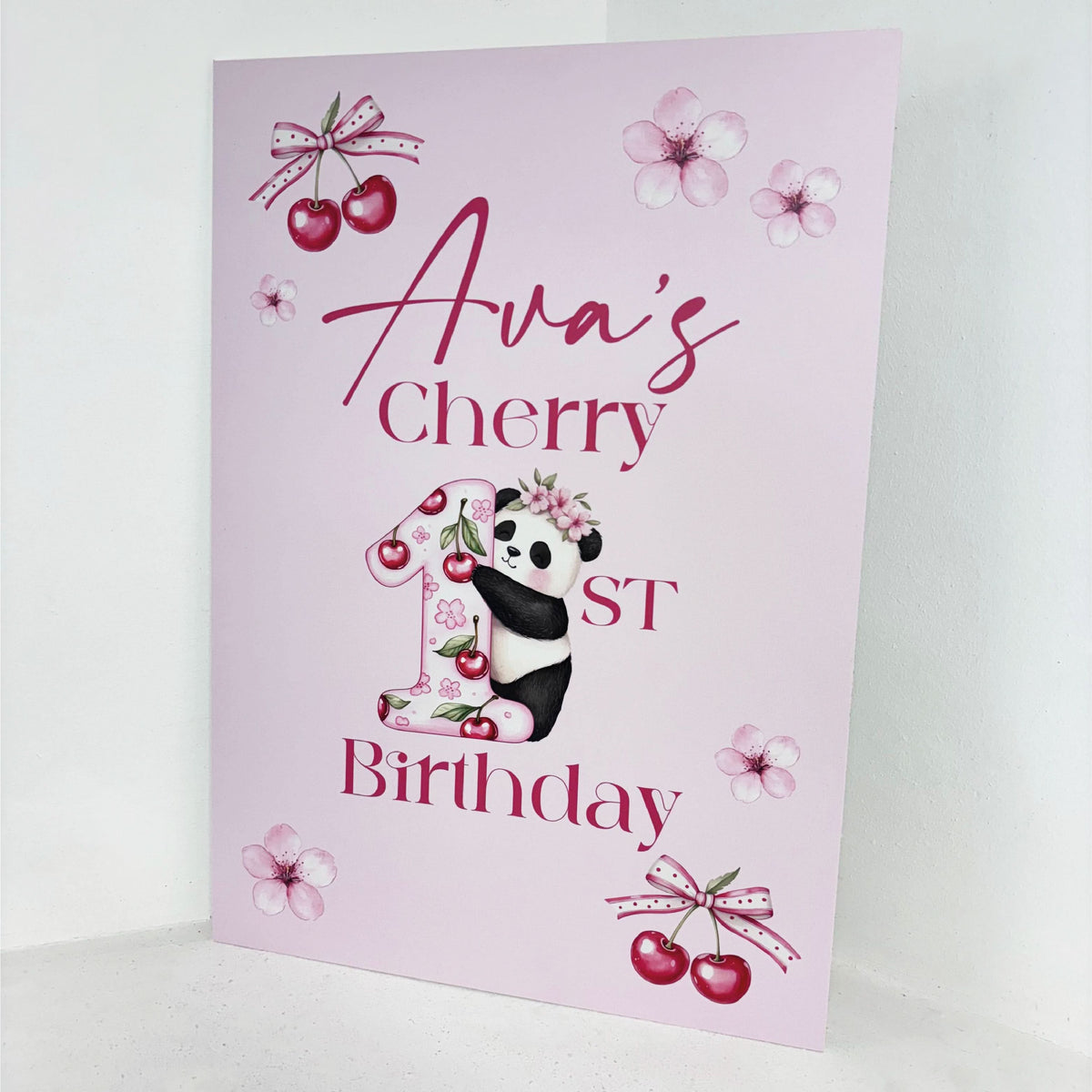 Close-up of Cherry First Birthday personalised 1st birthday easel sign with panda bear holding cherry blossoms, custom name and age on pink waterproof foamex board